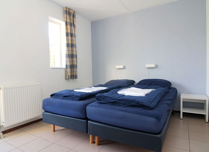 Das Ferienhaus D 760 in De Cocksdorp, Texel, bietet eine charmante Terrasse mit Gartenblick, ideal zum Entspannen auf den Watteninseln.