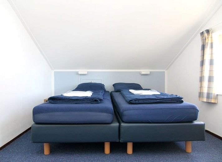 Das Ferienhaus D 760 in De Cocksdorp, Texel, bietet eine charmante Terrasse mit Gartenblick, ideal zum Entspannen auf den Watteninseln.