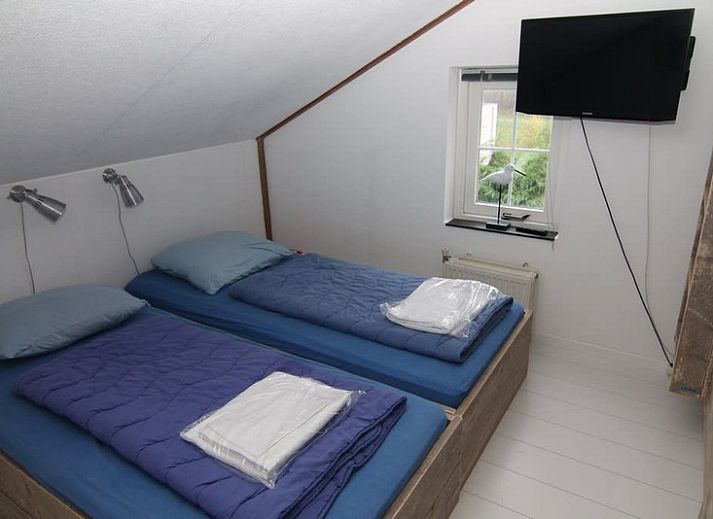 Vakantiehuis D 696 in De Cocksdorp, Texel, met ruim terras en groene tuin, ideaal voor ontspanning op de Waddeneilanden.