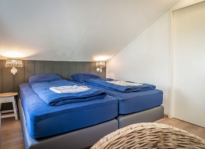 Vakantiehuis D 694 in De Cocksdorp, Texel biedt een zonnige tuin en terras, ideaal voor ontspanning op de Waddeneilanden.