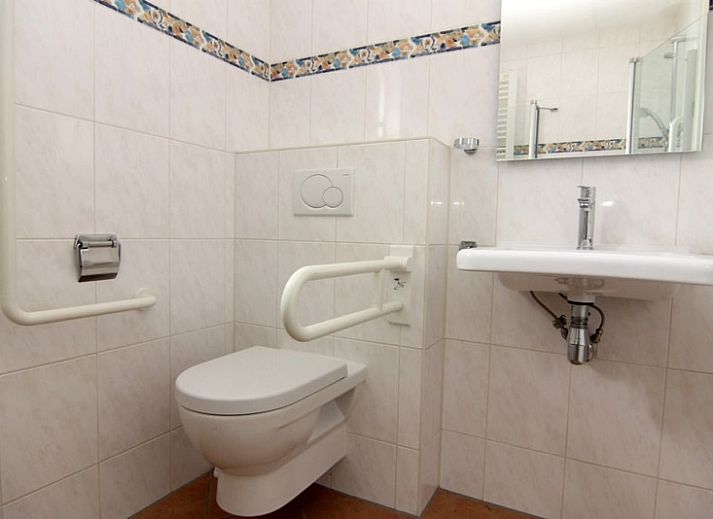 Vakantiehuis D 662 in De Cocksdorp, Texel, biedt een charmant verblijf met een zonnig terras en traditionele architectuur op de Waddeneilanden.