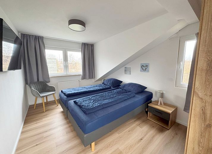 Enjoy the sunny terrace of Holiday home A 301 in De Cocksdorp, Texel, Wadden Islands, surrounded by green nature.