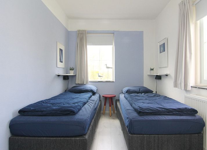 Vakantiehuis E 724 in De Cocksdorp op Texel biedt een charmant verblijf met een groene tuin en rustieke architectuur op de Waddeneilanden.