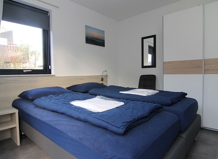 Vakantiehuis A 359 in De Cocksdorp, Texel biedt een serene buitenruimte met groene omgeving en uitnodigend terras op de Waddeneilanden.