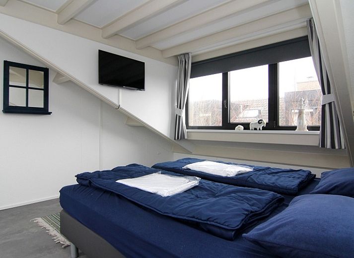 Vakantiehuis A 359 in De Cocksdorp, Texel biedt een serene buitenruimte met groene omgeving en uitnodigend terras op de Waddeneilanden.