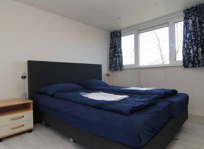 Geniet van het zonovergoten terras bij Vakantiehuis A 217 in De Cocksdorp, Texel, een perfecte plek voor ontspanning op de Waddeneilanden.