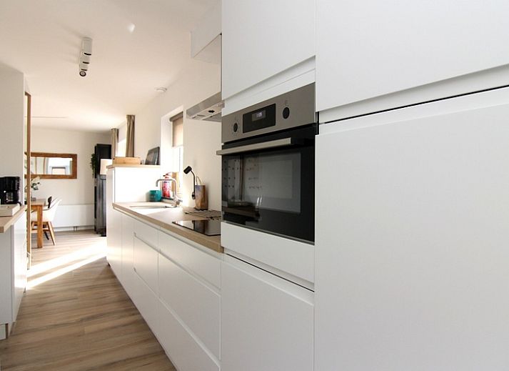 Vacation home A 075 in De Cocksdorp, Texel, Wadden Islands offers a modern exterior with spacious veranda for a relaxing stay.