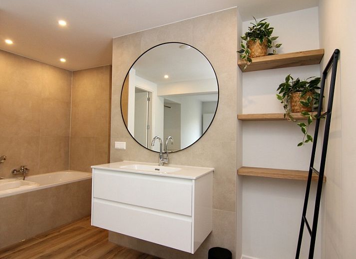 Vacation home A 075 in De Cocksdorp, Texel, Wadden Islands offers a modern exterior with spacious veranda for a relaxing stay.