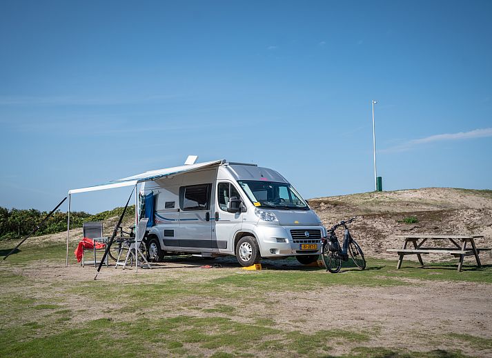 Enjoy nature at Sluftervallei Comfort camping site C1, located on Texel, overlooking dunes.