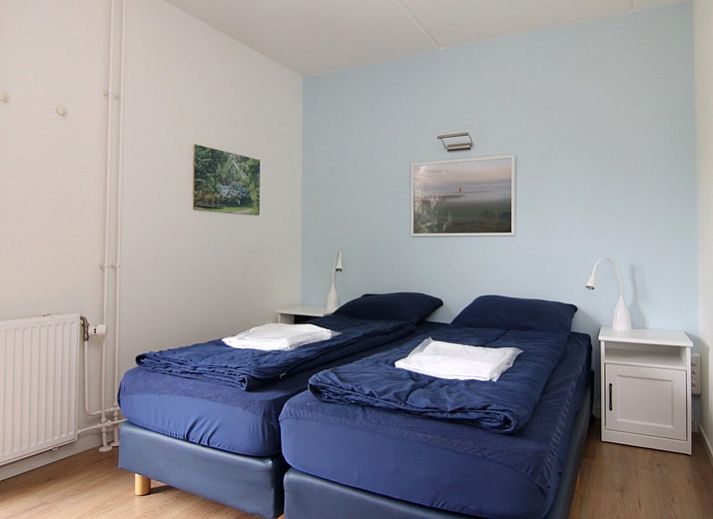 Ferienhaus D 657 in De Cocksdorp, Texel, umgeben von ueppiger Natur und einem sonnigen Garten, ideal fuer einen erholsamen Aufenthalt auf den Watteninseln.