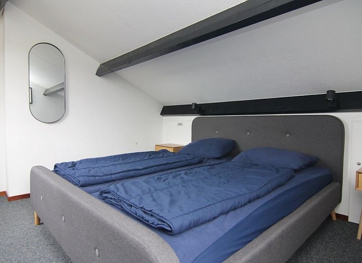 Vakantiehuis C 077 in De Cocksdorp, Texel, biedt een charmante buitenkant met ruime tuin, perfect voor een ontspannen verblijf op de Waddeneilanden.