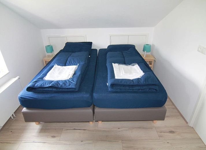 Vakantiehuis D 475 in De Cocksdorp, Texel, biedt een ruim verblijf met zonnige tuin en terras, ideaal voor een ontspannen vakantie op de Waddeneilanden.