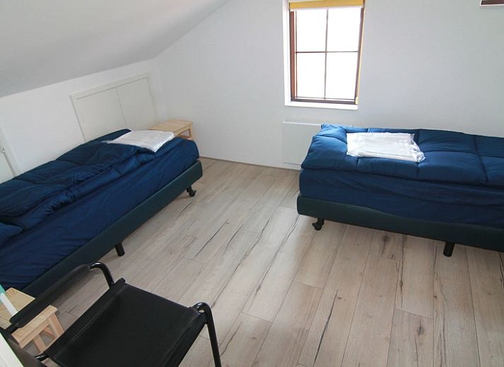 Vakantiehuis D 475 in De Cocksdorp, Texel, biedt een ruim verblijf met zonnige tuin en terras, ideaal voor een ontspannen vakantie op de Waddeneilanden.