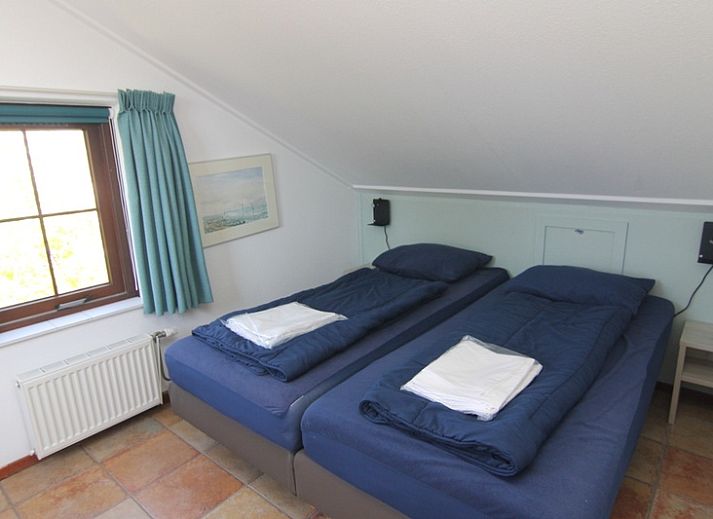 Vacation home E 645 in De Cocksdorp on Texel, a charming vacation home surrounded by nature on the Wadden Islands with inviting terrace.