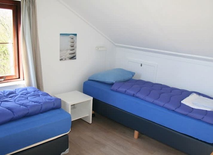 Vakantiehuis F 575 in De Cocksdorp, Texel biedt een charmante buitenruimte met groene tuin en uitnodigende natuur.