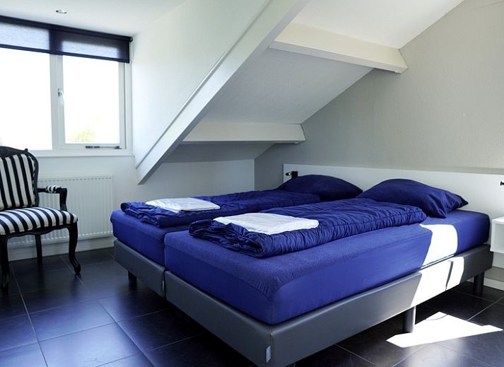 Vakantiehuis G 263 in De Cocksdorp, Texel biedt een charmant verblijf met moderne architectuur omgeven door groene natuur en rustige omgeving.