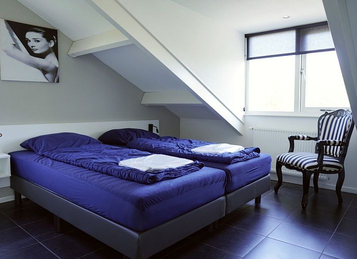 Vakantiehuis G 263 in De Cocksdorp, Texel, biedt een charmante buitenkant met terras, ideaal voor een ontspannen verblijf op de Waddeneilanden.