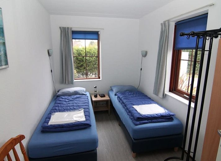 Vakantiehuis E 407 in De Cocksdorp, Texel biedt een charmante buitenkant met een groene omgeving op de Waddeneilanden.