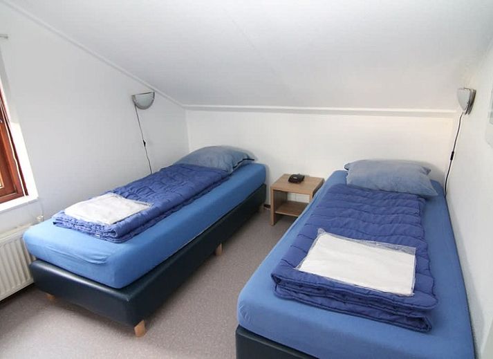 Vakantiehuis E 407 in De Cocksdorp, Texel biedt een charmante buitenkant met een groene omgeving op de Waddeneilanden.