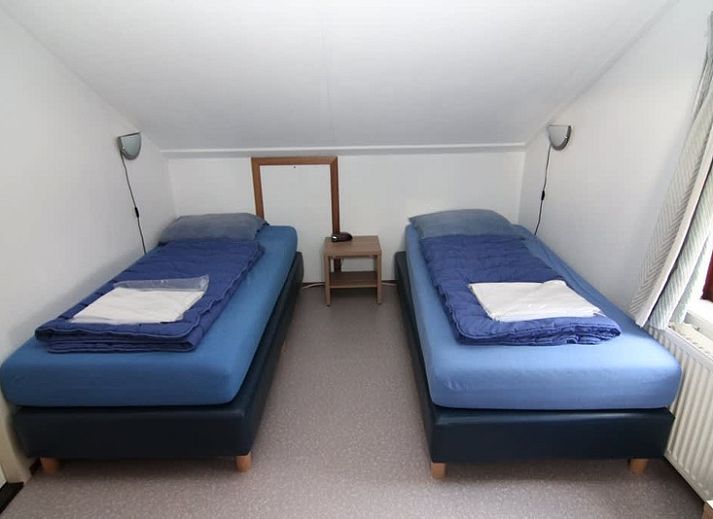 Vakantiehuis E 407 in De Cocksdorp, Texel biedt een charmante buitenkant met een groene omgeving op de Waddeneilanden.