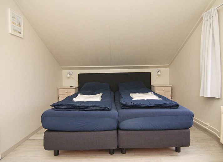 Vakantiehuis E 539, een charmant verblijf in De Cocksdorp, Texel, met uitnodigend terras en groene omgeving op de Waddeneilanden.