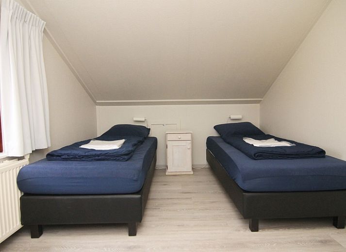 Vakantiehuis E 539 in De Cocksdorp, Texel, met een uitnodigend terras en groene omgeving op de Waddeneilanden.