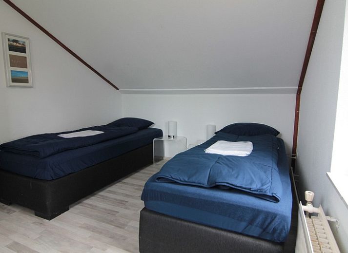 Vakantiehuis E 638 in De Cocksdorp, Texel, met zonnig terras en groene tuin, ideaal voor ontspanning op de Waddeneilanden.