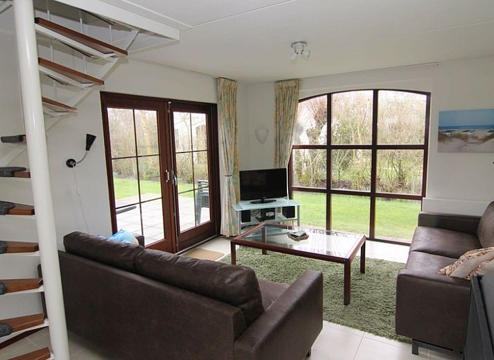 Vakantiehuis E 571 in De Cocksdorp, Texel, een charmant vakantiehuis omringd door groene natuur op de Waddeneilanden.