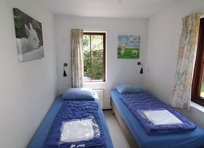 Vakantiehuis E 571 in De Cocksdorp, Texel, biedt een serene buitenruimte met moderne architectuur en groene omgeving op de Waddeneilanden.