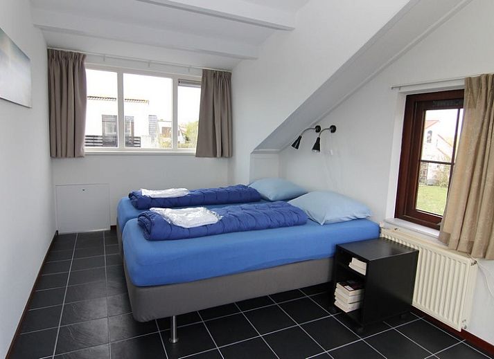 Vakantiehuis E 571 in De Cocksdorp, Texel, biedt een serene buitenruimte met moderne architectuur en groene omgeving op de Waddeneilanden.