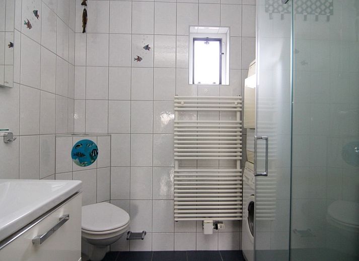 Vakantiehuis E 636 in De Cocksdorp, Texel, met zonnig terras en groene tuin, ideaal voor ontspannen verblijf op de Waddeneilanden.