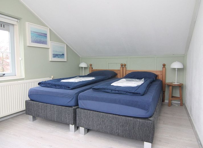 Vakantiehuis F 691 in De Cocksdorp, Texel, biedt een ruime tuin en zonnig terras voor een ontspannen verblijf op de Waddeneilanden.