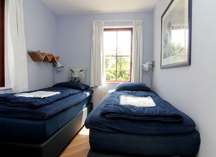 Das Ferienhaus F 789 in De Cocksdorp, Texel, bietet eine charmante Unterkunft im Freien mit einer Terrasse und gruener Umgebung auf den Watteninseln.