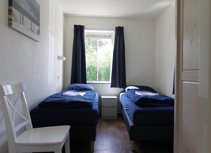 Vakantiehuis F 686 in De Cocksdorp, Texel biedt een serene tuin en terras, ideaal voor ontspanning op de Waddeneilanden.