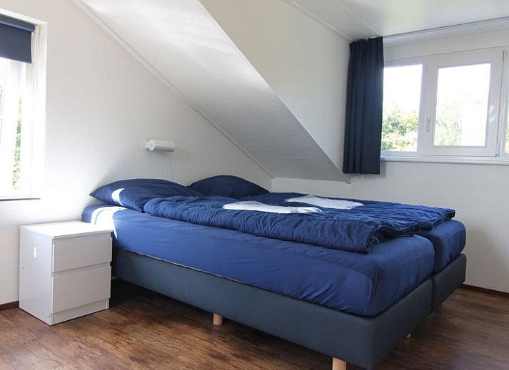 Vakantiehuis F 686 in De Cocksdorp, Texel met zonnig terras en groene tuin, ideaal voor ontspannen verblijf op de Waddeneilanden.