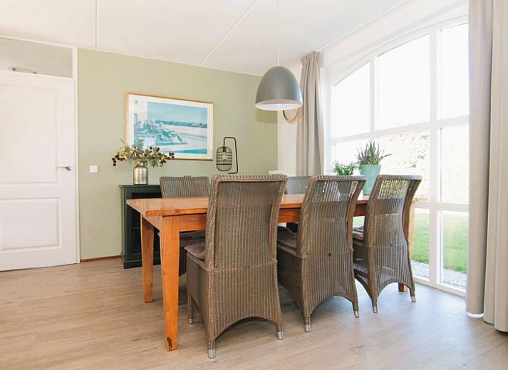 Vacation home F 681 in De Cocksdorp, Texel, surrounded by green nature and an inviting path to the front door.