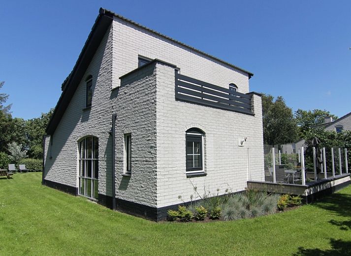 Vacation home F 776 in De Cocksdorp, Texel offers a serene outdoor space with green surroundings and spacious driveway, ideal for a relaxing stay.