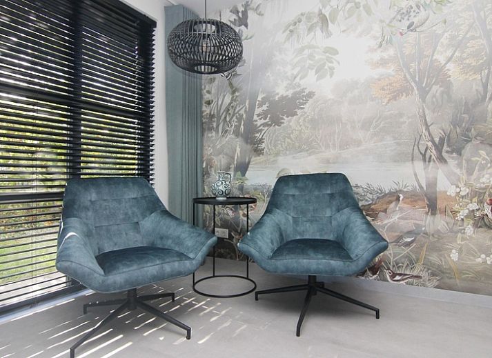 Vacation home E 525 in De Cocksdorp, Texel, offers a modern exterior with spacious garden, ideal for a relaxing stay on the Wadden Islands.