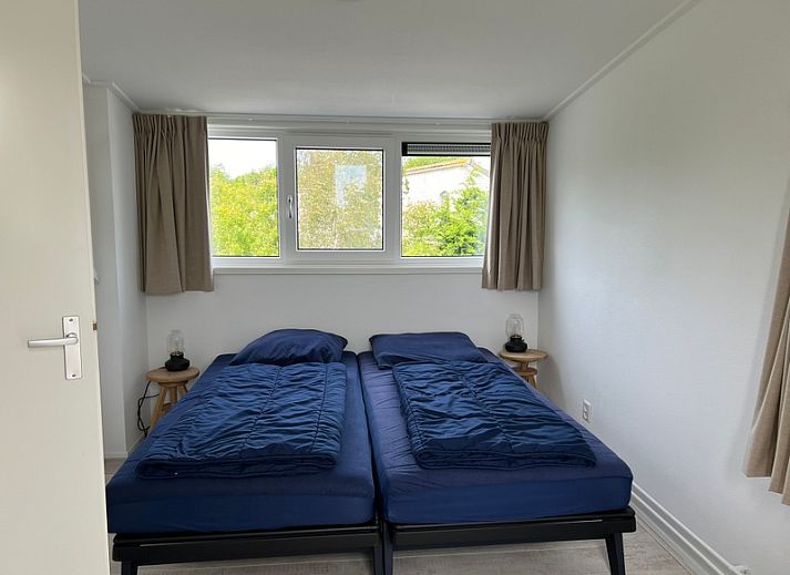 Vakantiehuis F 765 in De Cocksdorp, Texel, biedt een charmant verblijf met moderne architectuur en een rustige omgeving op de Waddeneilanden.