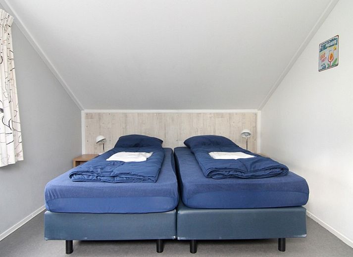 Vakantiehuis F 788 in De Cocksdorp op Texel biedt een charmante buitenkant met een zonnig terras en groene tuin, ideaal voor ontspanning.