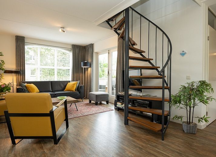 Vacation home E 541 in De Cocksdorp, Texel offers charming accommodation with an inviting frontage and green garden on the Wadden Islands.