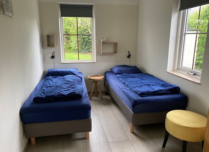 Vakantiehuis E 501 in De Cocksdorp, Texel biedt een ruime tuin en terras voor ontspanning te midden van de prachtige natuur van de Waddeneilanden.