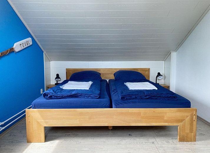 Vakantiehuis E 626 in De Cocksdorp, Texel, met zonnig terras en groene tuin, ideaal voor een ontspannen verblijf op de Waddeneilanden.