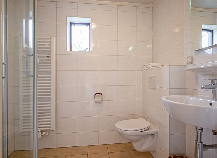 Gezellige woonkamer in Annemein vakantiehuis, De Cocksdorp, Texel met comfortabele zithoek en moderne inrichting.