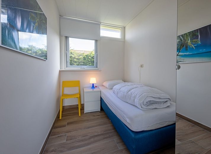 Gezellige woonkamer van Vakantiehuis Slufterhoek 080 in De Cocksdorp, Texel, met moderne inrichting en veel natuurlijk licht.