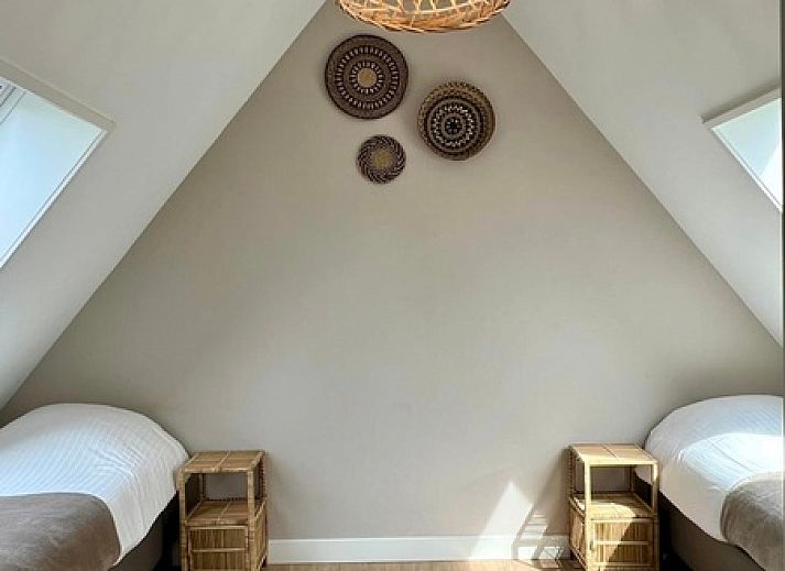 Stijlvolle woonkamer van Vakantiehuis Noordwester in De Koog, Texel met comfortabele meubels.