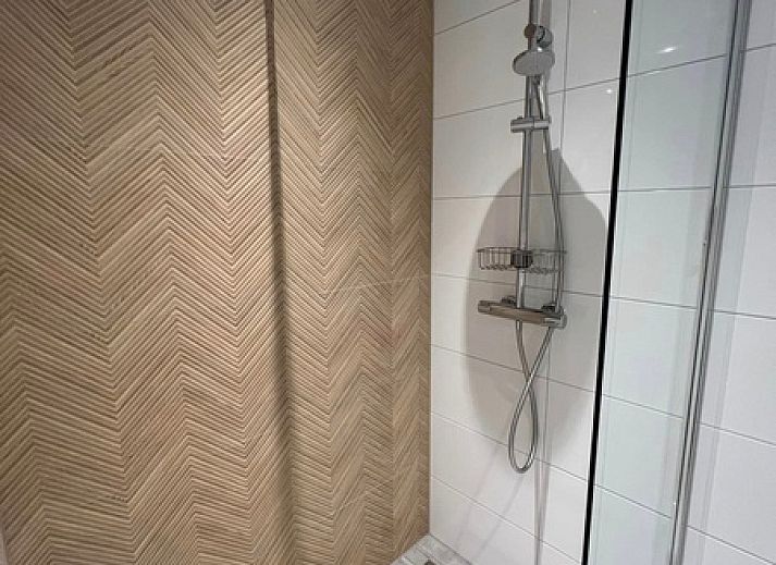 Stijlvolle woonkamer van Vakantiehuis Noordwester in De Koog, Texel met comfortabele meubels.