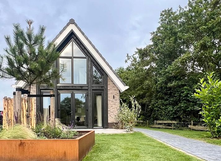 Stijlvolle woonkamer van Vakantiehuis Noordwester in De Koog, Texel met comfortabele meubels.