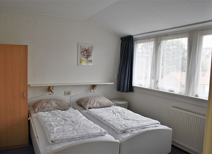 Vakantiehuis Watersnip in De Koog, Texel met charmante gevel en groene tuin.