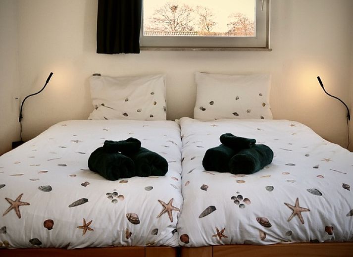 Ontspan aan het zwembad van Stappeland - Huize 100-1, een vakantiehuis in De Koog, Texel, voor een rustige vakantie.